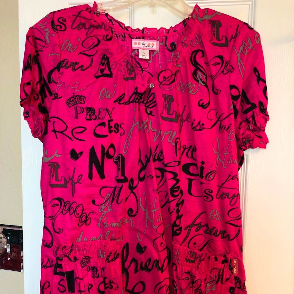 KOI L Scrub Top. Pre-Owned but looks new & true to size!  Smoke Free Home!!